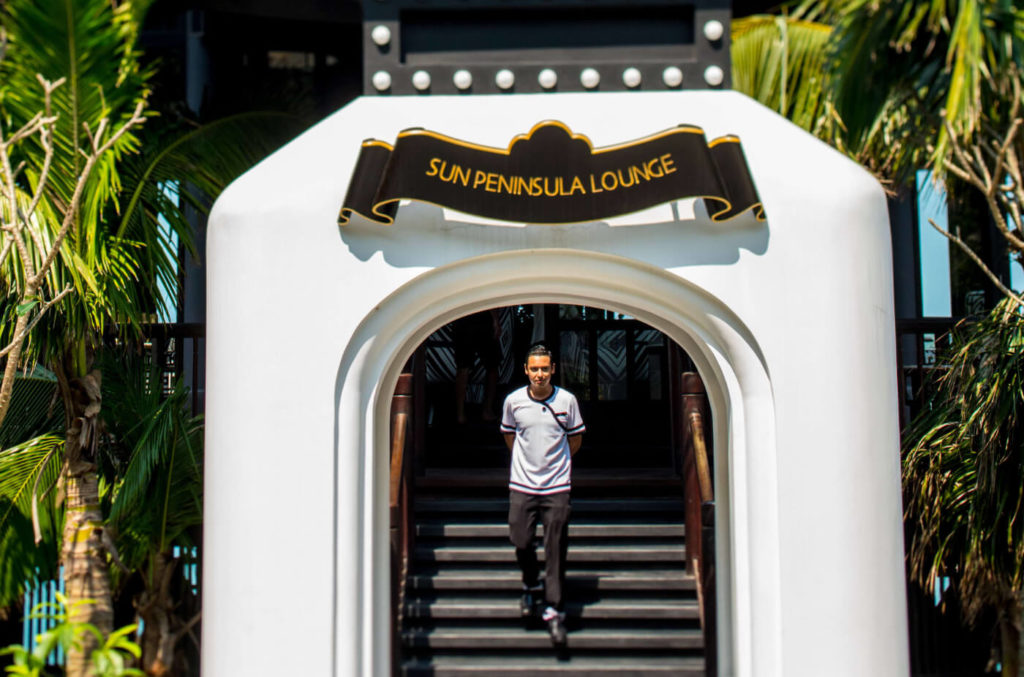 A waiter walking down the steps at the entrance to the Club InterContinental Lounge