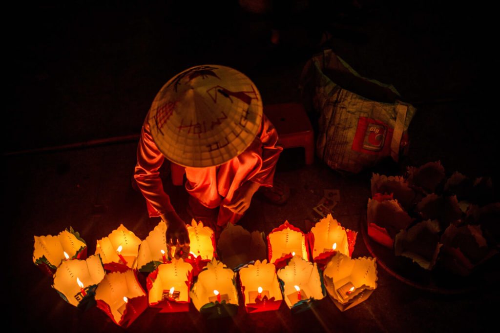 Woman with floating lanterns in Hoi An, Vietnam