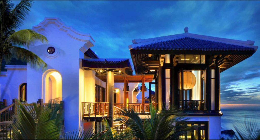 Exterior of Royal Residence with sunset and ocean view at the luxury InterContinental Danang Resort.