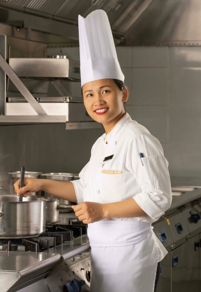 Chef Thu cooking at her work station