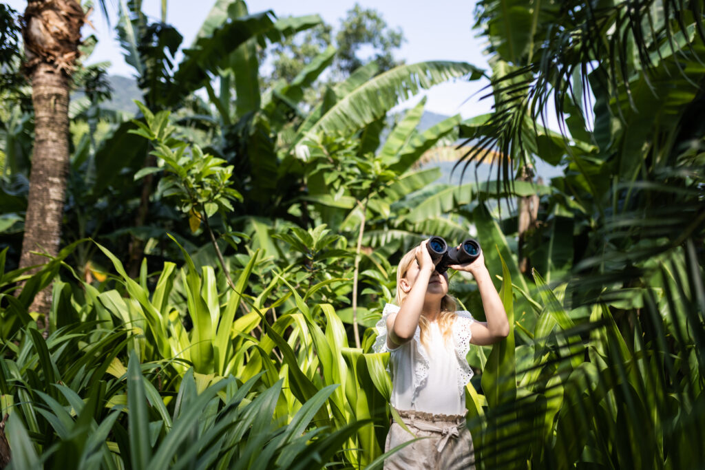 Girl exploring Nature with binoculars